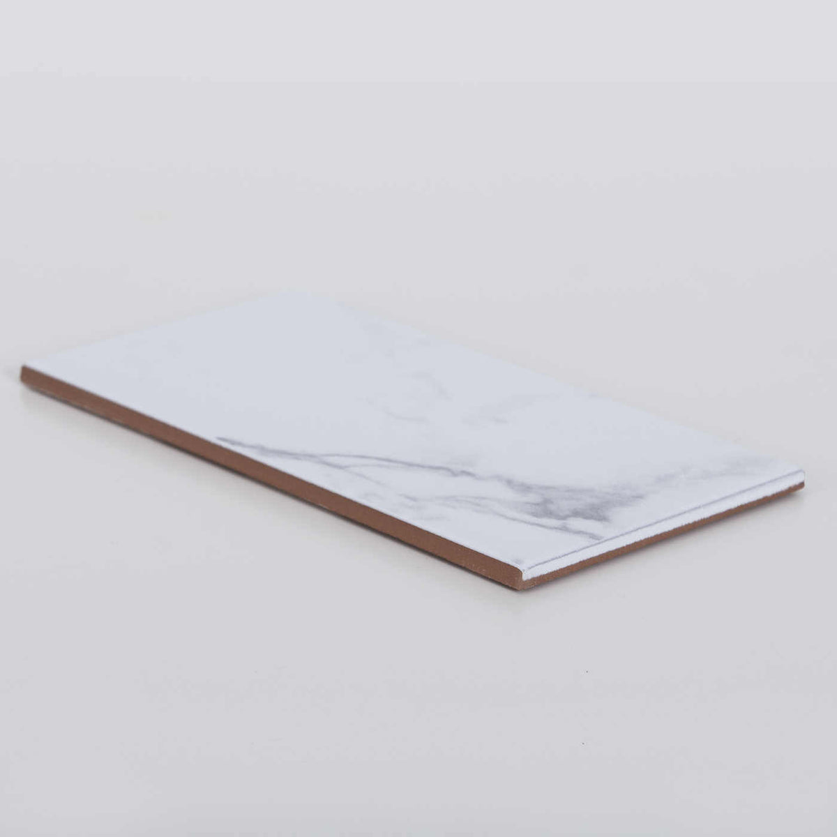 Kakel Carrara Marmor 10x20